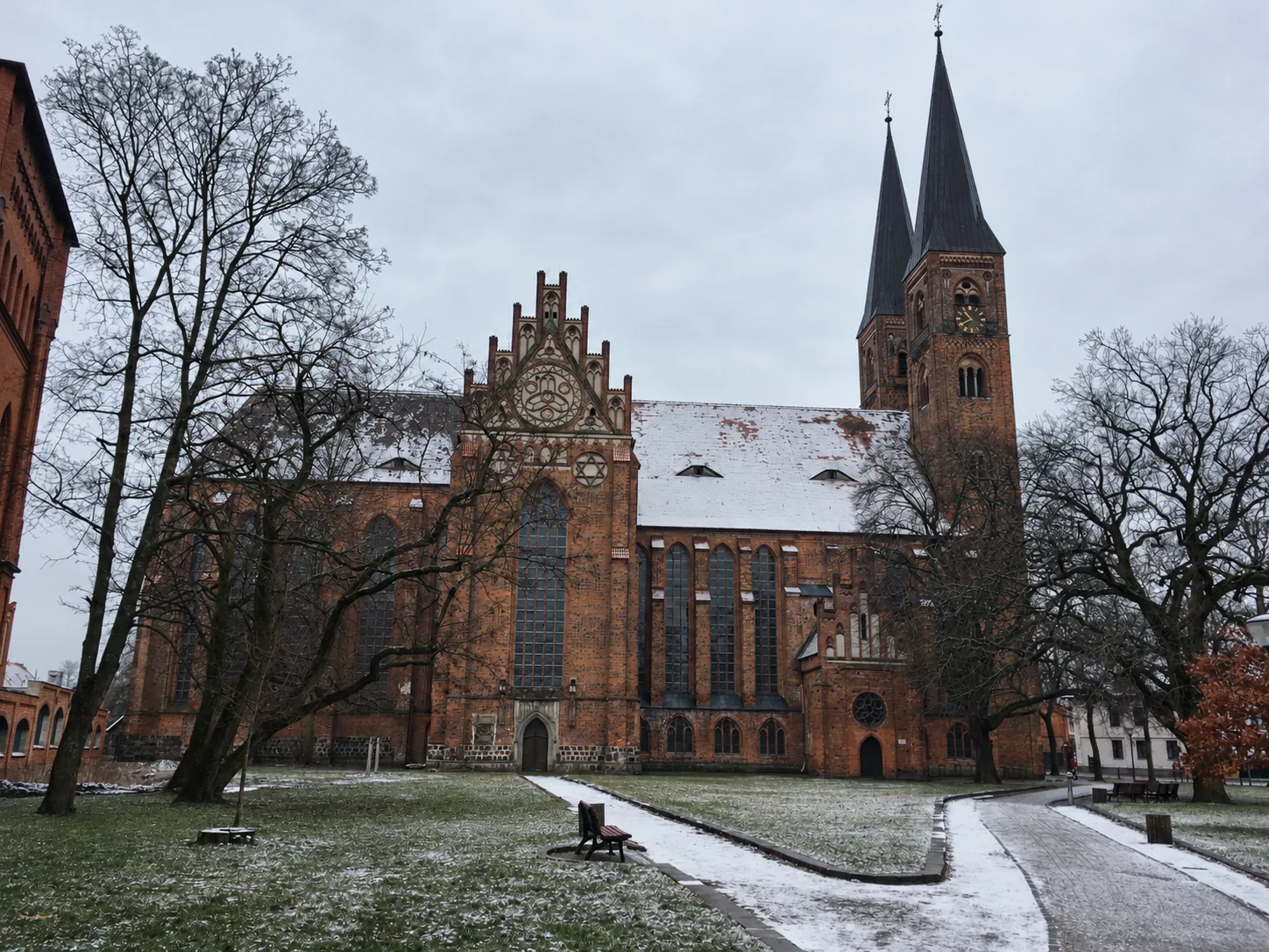 Twin-spired brick church in winter